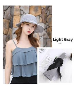 Foldable light grey straw sun hat for women featuring a wide black bow ribbon detail