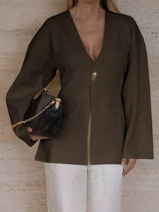 Detail view of a dark brown V-neck cardigan with single-button closure and long sleeves