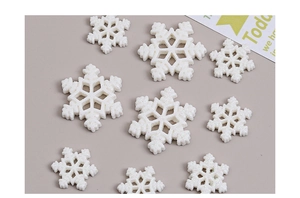 Close-up of assorted white glitter snowflakes for Christmas DIY resin accessories