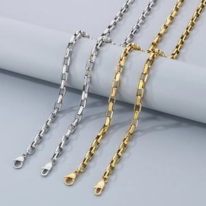 Detail of silver and gold 18K plated stainless steel box chains with lobster clasps