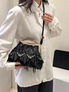 Vintage black sequin shell bag with fringe tassels and gold handle for formal occasions