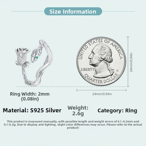 Detail view of silver snake and rose ring next to a coin for size reference