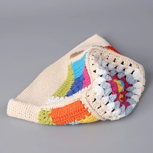 Handmade crochet rainbow bucket hat with colorful bohemian grandma square knit patterns