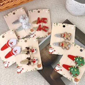 Christmas hair clip set featuring reindeer and Santa Claus designs for kids