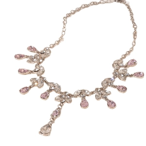 French style silver necklace with marquise and pink teardrop stones on white background