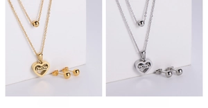 Close-up of gold and silver layered necklaces with hollow heart pendants and stud earrings