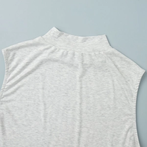 Detail of heather grey mock neck sleeveless top showing the soft knit fabric texture