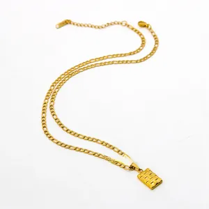 Detail of gold-plated stainless steel Figaro chain with a textured rectangle pendant