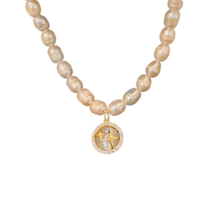 Baroque freshwater pearl necklace featuring a golden star pendant with opal stone detail