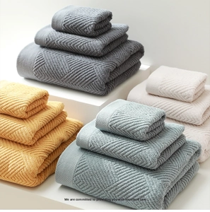 Close-up of premium thick cotton towel set with 3D diamond weave texture in four colors