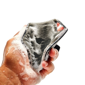 Polygonal silicone body scrubber with ergonomic grip and dense bristles in dark gray