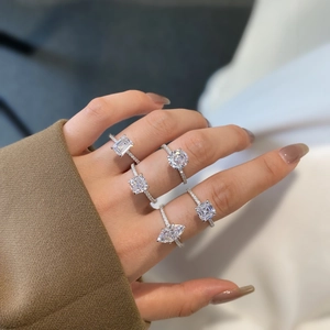 Five styles of S925 silver rings with diamond cuts shown on fingers for elegant look