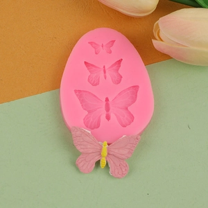Pink silicone butterfly fondant mold with finished decor for cake decorating and DIY crafts