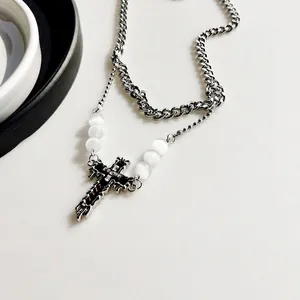 Double-layer silver cross pendant necklace with Cuban chain and white bead accents