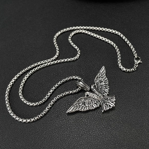 Detailed view of punk style stainless steel double-headed eagle pendant and box chain