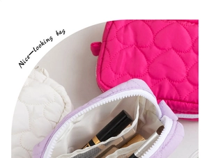 Detail of heart quilted cosmetic bags with mesh pockets and secure zipper closure