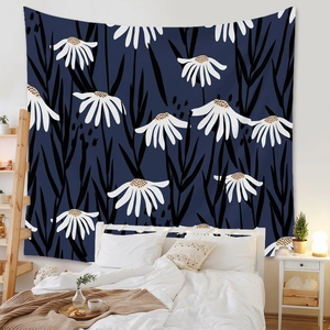 Bohemian floral wall tapestry featuring white daisies and black leaves in a bedroom setting
