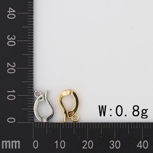 Close-up of 18K gold and silver threaded eyelet connectors with 0.8g weight label