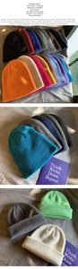 Detail showing various colors of knitted beanies with 55-58cm sizing specifications