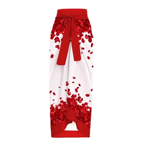 Detail of red rose petal print and tie waist on a white bridal beach wrap skirt