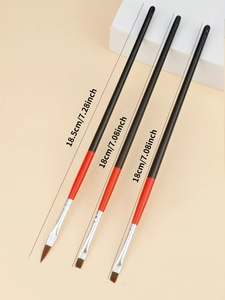 Detailed view of 3 professional nail art brushes with red and black wooden handles and dimensions