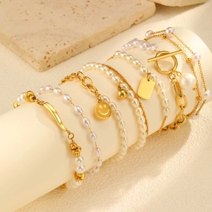 Minimalist pearl and gold chain bracelet set with smiley face and square plate pendants
