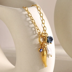 18K gold plated stainless steel necklace with fish, blue eye, and pearl charms