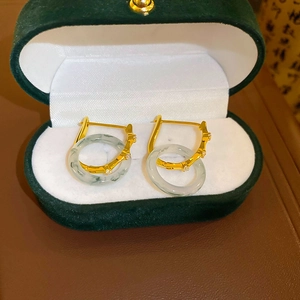 Bamboo style gold earrings with green jade pendant and crystals in a velvet gift box