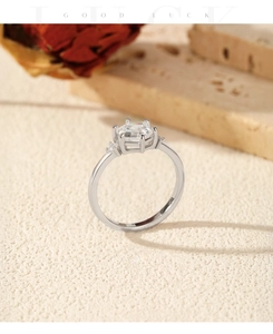 Macro view of S925 silver hexagonal ring with emerald-cut cubic zirconia and fine side stones