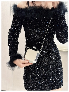 Silver geometric clutch with metallic finish and chain strap on stylish sequined dress