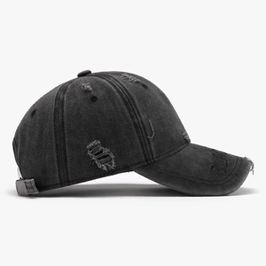 Vintage washed baseball cap in dark grey with distressed details and black brim embossing