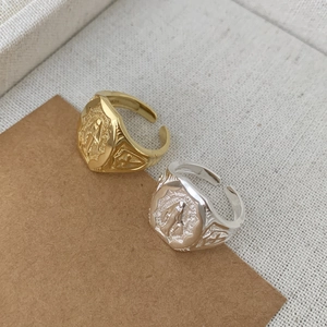 Detailed close-up of S925 sterling silver Maria ring with engraved religious pattern