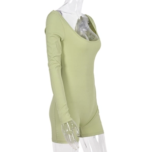 Detailed side view of light green ribbed long sleeve bodysuit with U-neck on a model