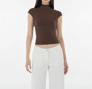 Close-up of slim fit dark brown mock neck t-shirt with high elasticity and neat stitching