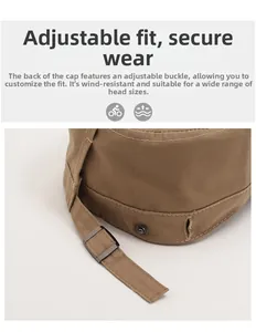 Détail de la boucle en métal ajustable et du tissu en toile kaki sur une casquette plate