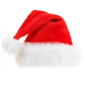 Close-up of a plush red Christmas hat with soft white faux fur trim and fluffy pompom