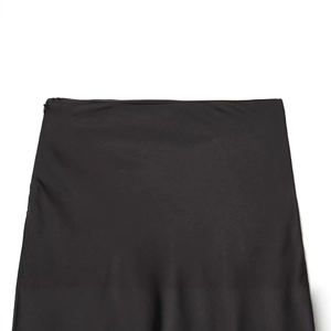 Women's black asymmetric skirt with lace details and side zipper waist design
