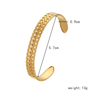 Detail view of woven gold bracelet showing 0.9cm width and 5.7cm inner diameter