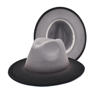 Detail of gradient grey to black wool fedora hat showing top and side profile views