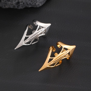 Detailed view of adjustable punk arrow ring in gold and silver over black leather
