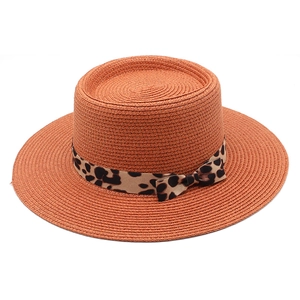 Orange flat top straw sun hat with leopard print ribbon bow for beach vacations