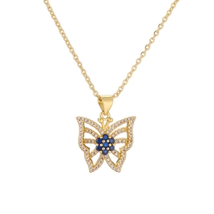 Golden hollow butterfly necklace with blue sapphire-like stones and diamond trim on white background