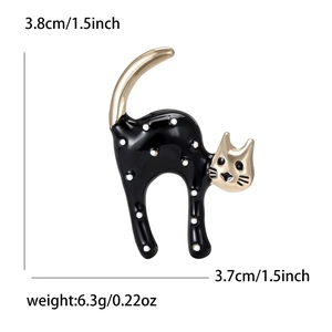 Cute black enamel cat brooch with white spots and gold accents with size dimensions