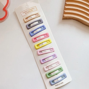 Set of 10 colorful rectangle snap hair clips displayed on white card packaging