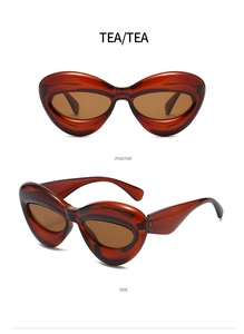 Detail view of tea-colored bubble cat-eye sunglasses from front and side angles