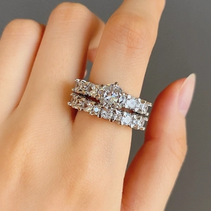 Sparkling wedding ring set with cubic zirconia stones and 6-prong silver engagement ring