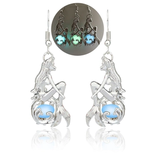 Luminous mermaid drop earrings showing glowing blue and green beads in dark view