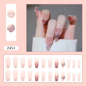 Pink gradient press-on nails with 3D purple butterflies and shimmering glitter finish
