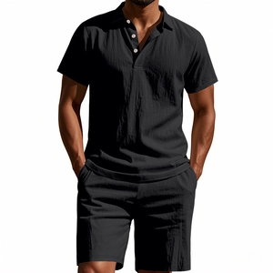 Detail of men's black cotton linen polo shirt and shorts set showing fabric texture