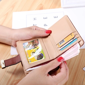 Women's minimalist beige bi-fold wallet featuring brown buckle and multiple card slots